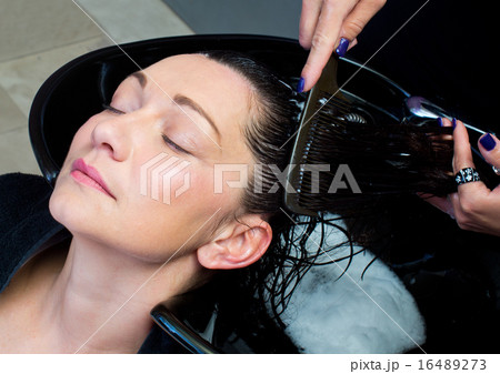woman get hair washing and combing woman get hair washing and combing 16489273