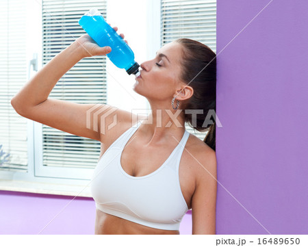 fit woman with energy drink fit woman with energy drink 16489650