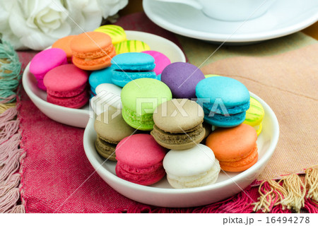 Colorful macarons on white plate Close up image Colorful macarons on white plate Close up image 16494278