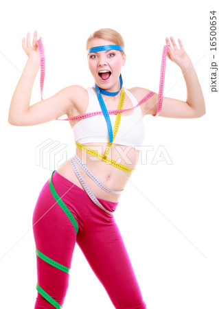 Obsessed fitness woman with a lot of colorful measure tapes Obsessed fitness woman with a lot of colorful measure tapes 16500654