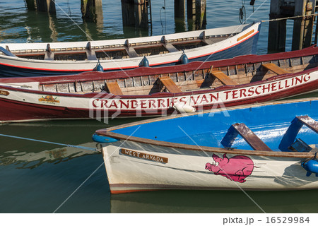 Colored rowing boats in a harbor 16529984
