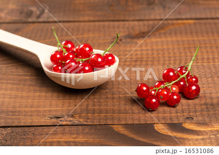 Red Currant On Brown Wooden Table 16531086