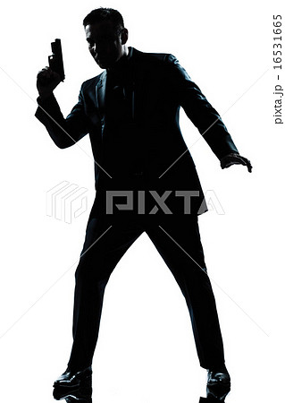 silhouette man spy holding gun silhouette man spy holding gun 16531665