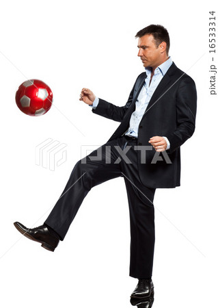 one business man playing juggling soccer ball one business man playing juggling soccer ball 16533314