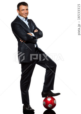 one business man standing foot on soccer ball one business man standing foot on soccer ball 16533315