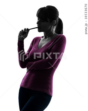 woman thinking chewing pen portrait silhouette 16533670