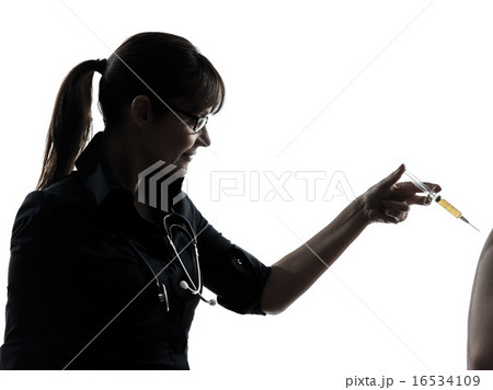 woman doctor holding surgical needle vaccination silhouette 16534109