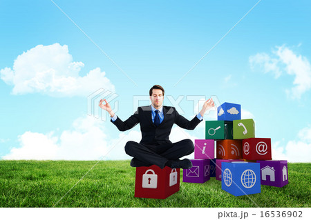 Composite image of calm businessman sitting in lotus pose 16536902