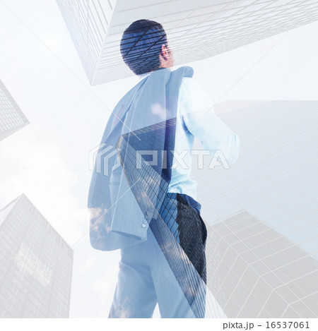 Composite image of businessman holding his jacket Composite image of businessman holding his jacket 16537061