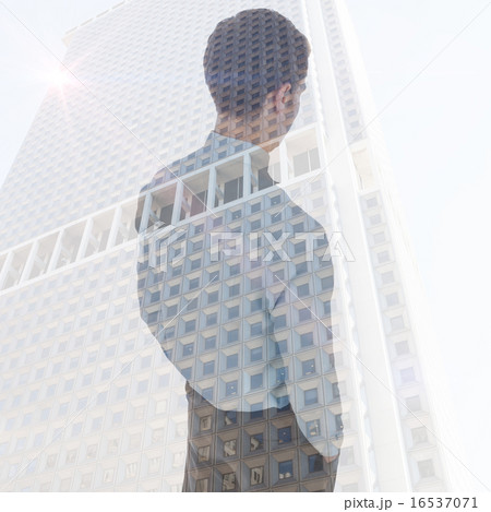 Composite image of businessman standing with hands in pockets Composite image of businessman standing with hands in pockets 16537071