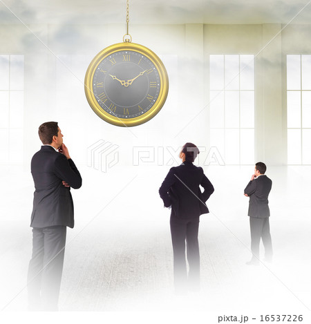 Composite image of businessman standing and looking Composite image of businessman standing and looking 16537226
