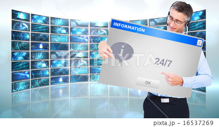 Composite image of happy businessman with headphone presenting a 16537269