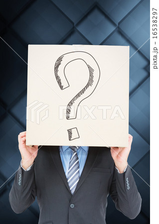 Composite image of businessman hiding head with a box Composite image of businessman hiding head with a box 16538297