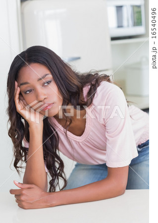 Sad woman thinking at the counter Sad woman thinking at the counter 16540496