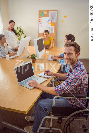 Creative casual businessman in wheelchair 16540730