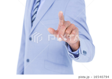 Handsome businessman gesturing with hands 16540794