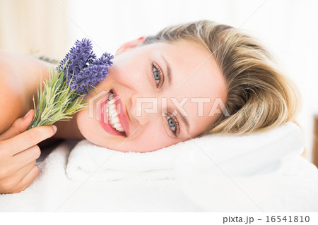 Beautiful blonde lying on massage table with lavanda 16541810