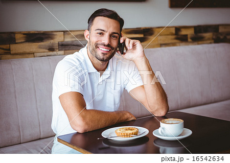 Young man smiling on the phone 16542634