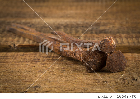 Vintage hammer with nails on wood background 16543780