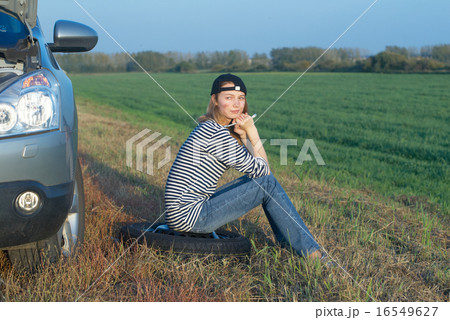 Young Blond Woman With Her Broken Car Young Blond Woman With Her Broken Car 16549627