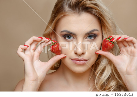 Attractive young woman with red sweet berry 16553012