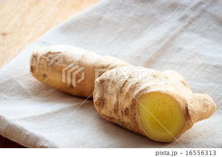 Closeup fresh raw ginger on rustic table 16556313