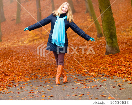 girl relaxing walking in autumnal park, outdoor girl relaxing walking in autumnal park, outdoor 16556638