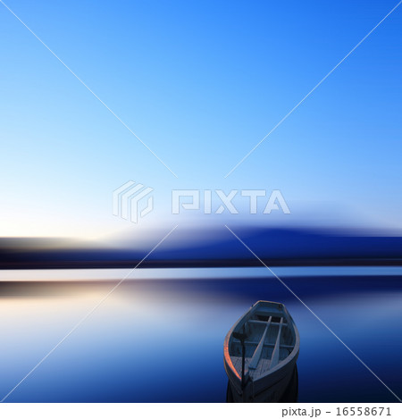 Single boat in long exposure in dusk 16558671