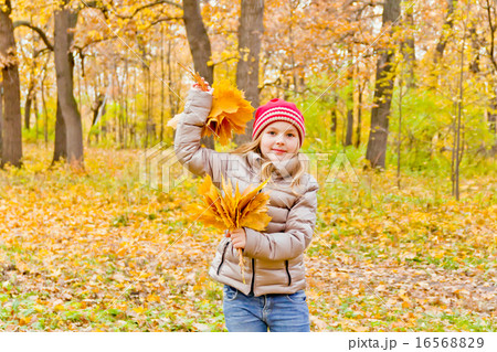 Cute dancing girl in autumn 16568829