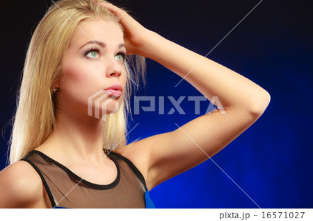 Portrait pensive girl long blond hair 16571027
