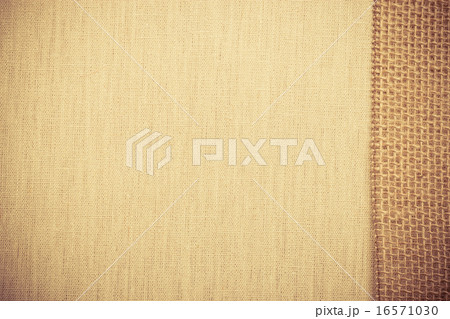 Jute ribbon on linen cloth background 16571030