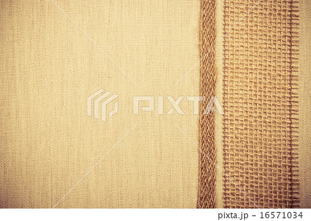 Jute ribbon on linen cloth background 16571034