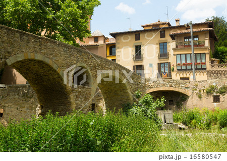 Old stone bridge over river in Vic 16580547
