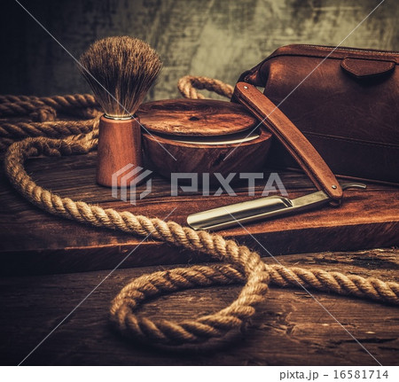 Shaving accessories on a luxury wooden background 16581714