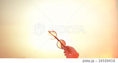 Female holding sunglasses Female holding sunglasses 16589418