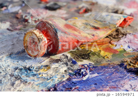 Closeup of old oil paint tube with red colour  16594971