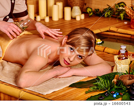 Woman getting stone therapy massage . Woman getting stone therapy massage . 16600543
