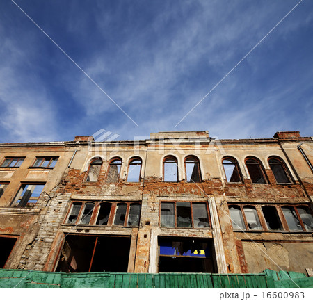 Facade of old destroyed house. Wide-angle view. Facade of old destroyed house. Wide-angle view. 16600983