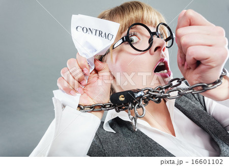 Furious woman with chained hands and contract Furious woman with chained hands and contract 16601102