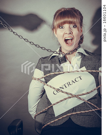 Upset businesswoman bound by contract terms. Upset businesswoman bound by contract terms. 16601104