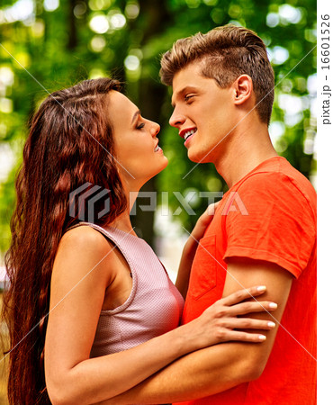 Couple  with flower at park. 16601526