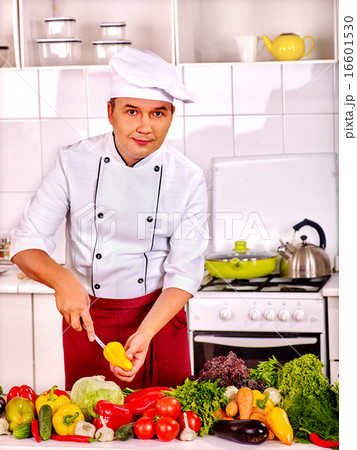 Man in chef hat cooking chicken Man in chef hat cooking chicken 16601530