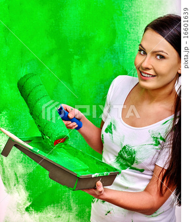 Woman paint wall at home. Woman paint wall at home. 16601639