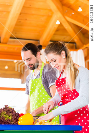 Couple cooking in domestic kitchen healthy food 16613861