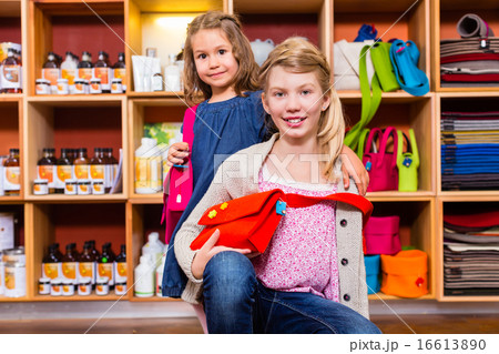 Children buying supplies in handicraft store 16613890