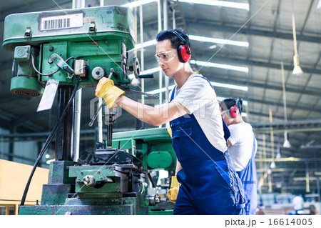 Asian worker in production factory drilling 16614005