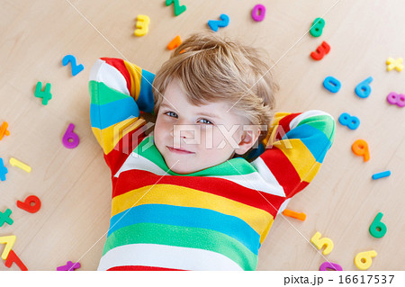 Kid boy with colorful numbers, indoor Kid boy with colorful numbers, indoor 16617537