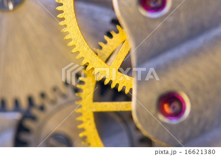 Background with metal cogwheels a clockwork. macro 16621380