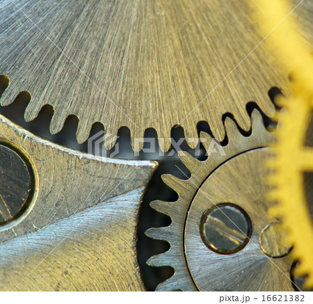 Background with metal cogwheels a clockwork. macro 16621382