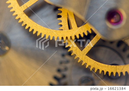 Background with metal cogwheels a clockwork. macro 16621384